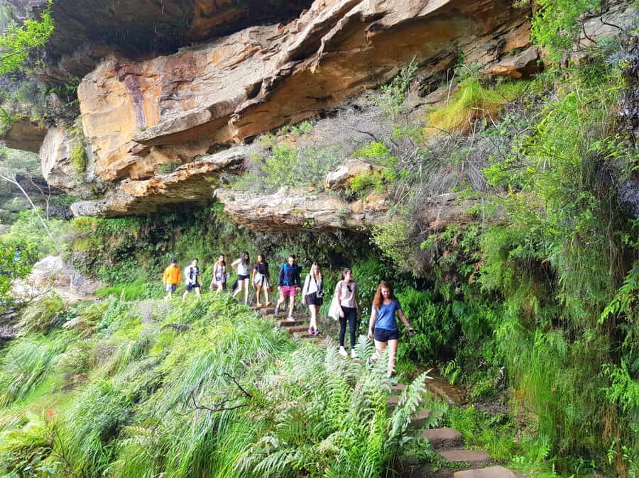 From Sydney: Blue Mountains Tour with Waterfall Walk & Lunch - Three Sisters in Katoomba: rocks, views, and a Dreamtime story