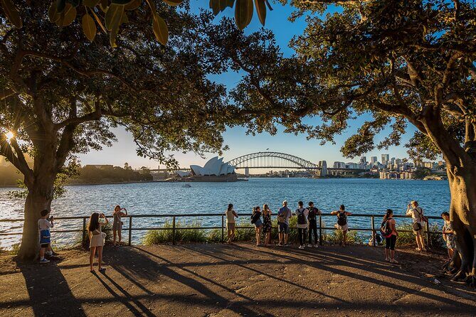 Private Sydney Harbour Sunset Photo Tour & Cruise - Milsons Point at sunset: the bridge arch and lit-up water glow